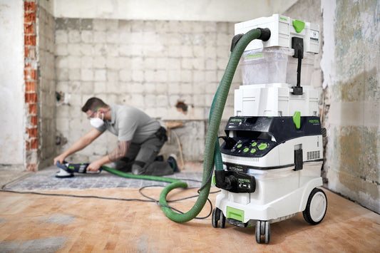 Festool RENOFIX RG 130 ECI Sanierungsschleifer mit Absauganlage bei Altbeschichtung-Entfernung auf Betonboden in Baustelle