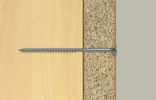 Querschnittsdarstellung einer Holzschraube zur sicheren Befestigung von Massivholz auf Holzwerkstoffplatten.